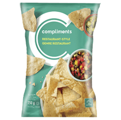 Green package of Compliments Restaurant Style Tortilla Chips