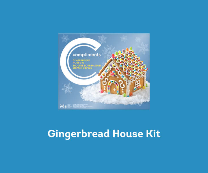 A blue box of Compliments Gingerbread House Kit