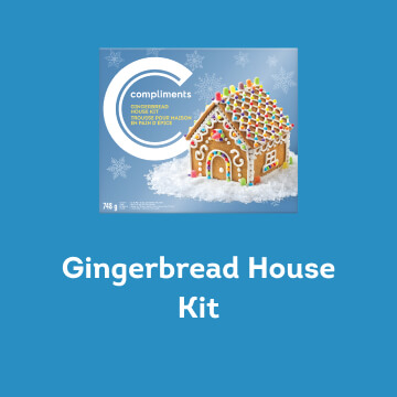 A blue box of Compliments Gingerbread House Kit